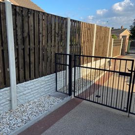 wooden fence and metal gate